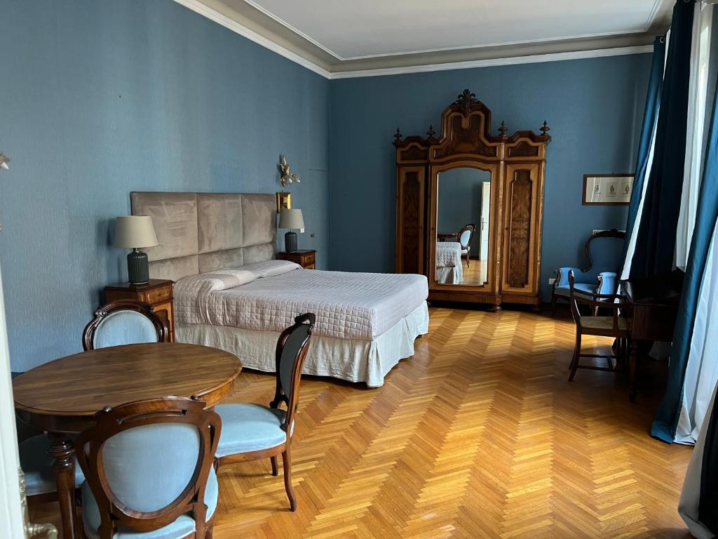 Postel nebo postele na pokoji v ubytování Residenza Scaligera