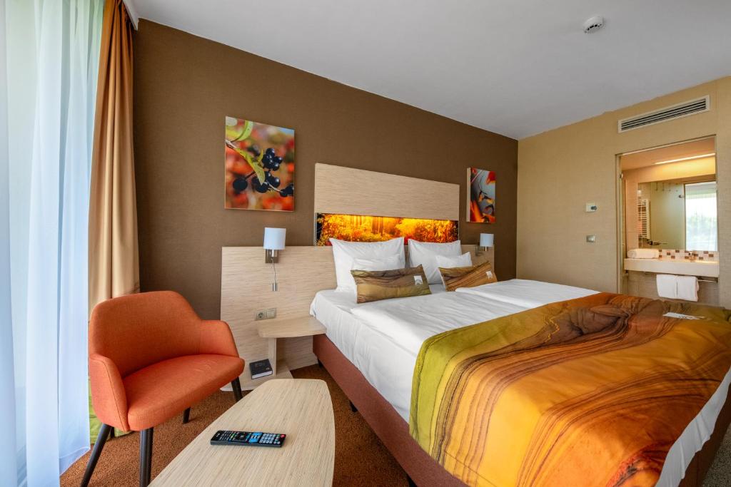 Postel nebo postele na pokoji v ubytování Lifestyle Hotel Mátra