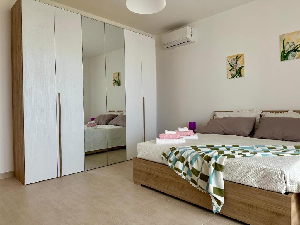 Uma cama ou camas num quarto em Attico al Sovrano - Nel cuore della Puglia!