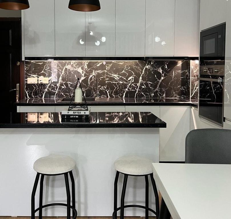Kuchyň nebo kuchyňský kout v ubytování Belle Apartment