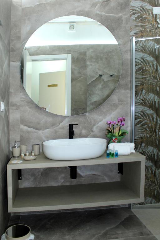 a bathroom with a sink and a mirror at Tenuta Paifer in Otranto
