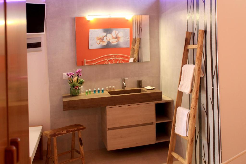 a bathroom with a sink and a mirror at Tenuta Paifer in Otranto