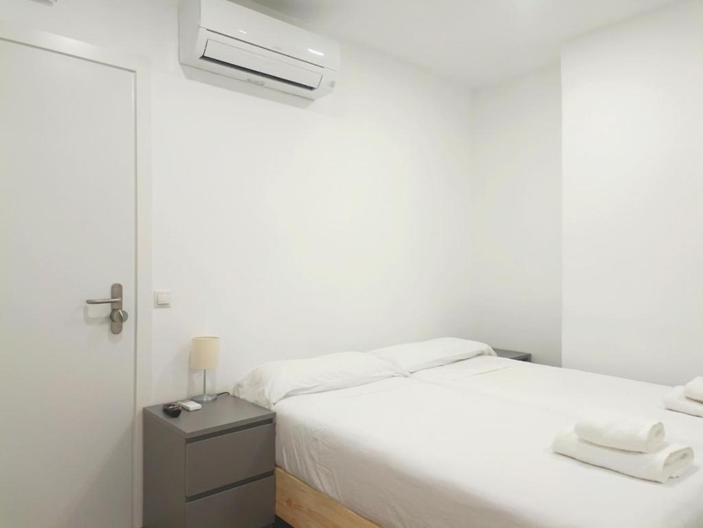 A bed or beds in a room at Casa de Huéspedes 12 Octubre Rooms