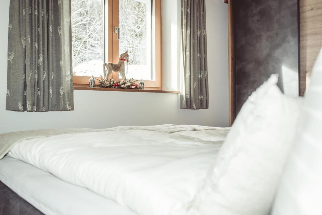 Postel nebo postele na pokoji v ubytování Appartement Bergwild