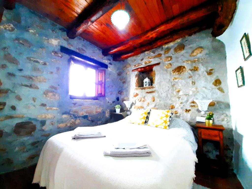 A bed or beds in a room at Petit Nazari
