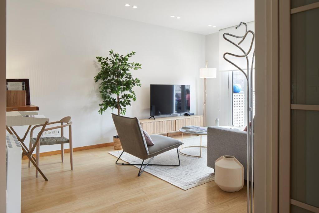 Televízia a/alebo spoločenská miestnosť v ubytovaní La Terraza by FeelFree Rentals