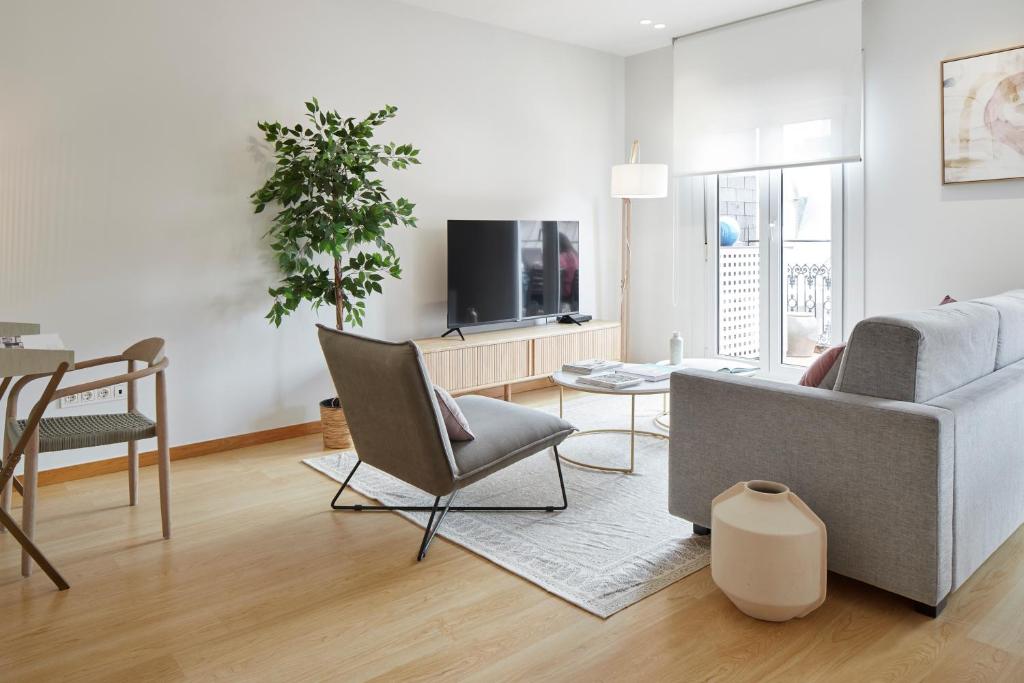 Televízia a/alebo spoločenská miestnosť v ubytovaní La Terraza by FeelFree Rentals