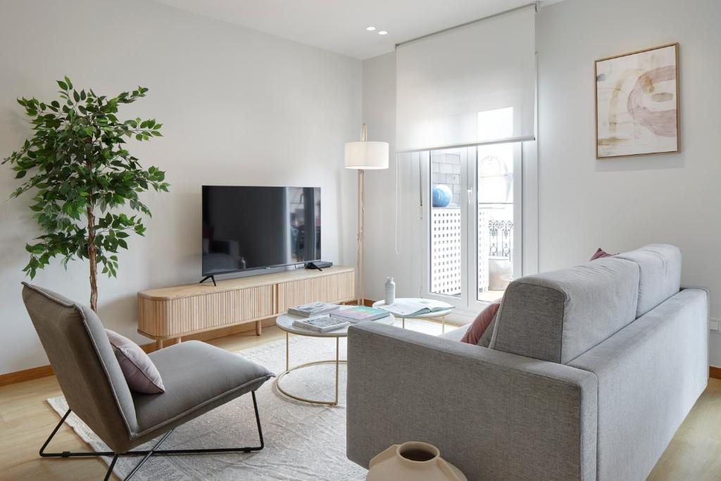 Televízia a/alebo spoločenská miestnosť v ubytovaní La Terraza by FeelFree Rentals