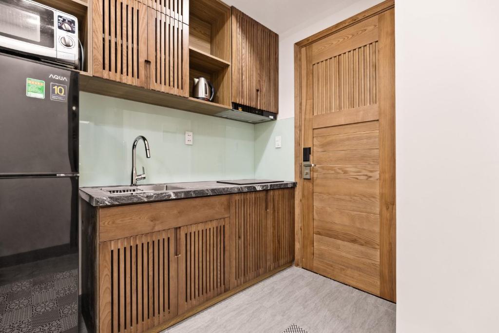 Kuchyň nebo kuchyňský kout v ubytování Hoàng Thịnh Hotel & Apartment Danang