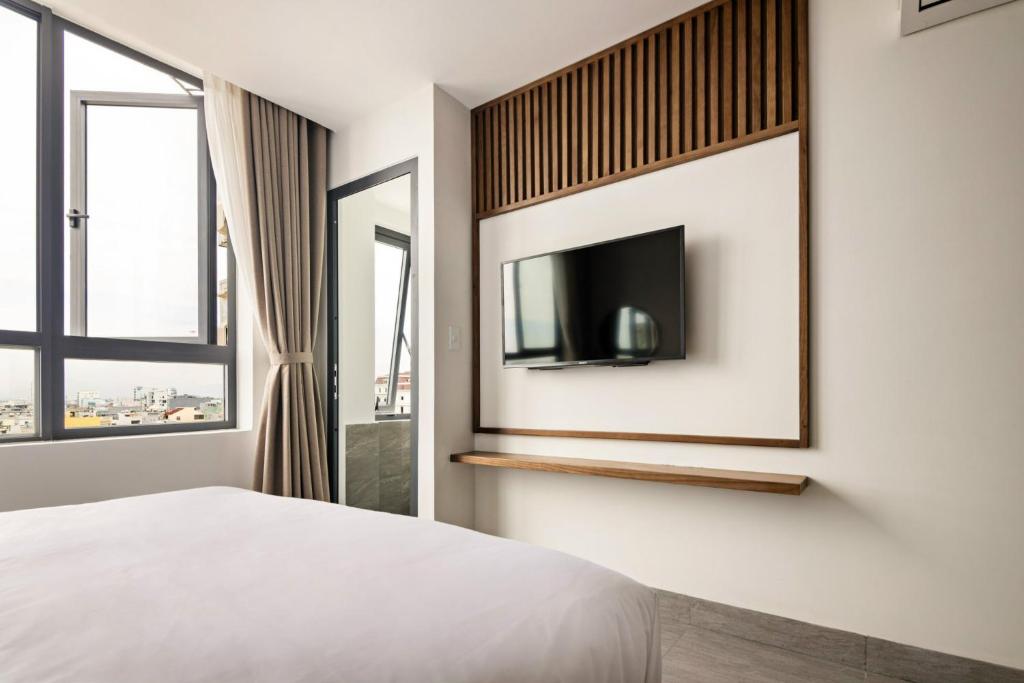 TV a/nebo společenská místnost v ubytování Hoàng Thịnh Hotel & Apartment Danang