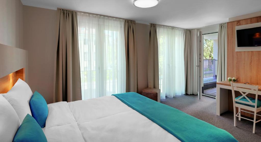 Postel nebo postele na pokoji v ubytování Hotel und Pension Seereich