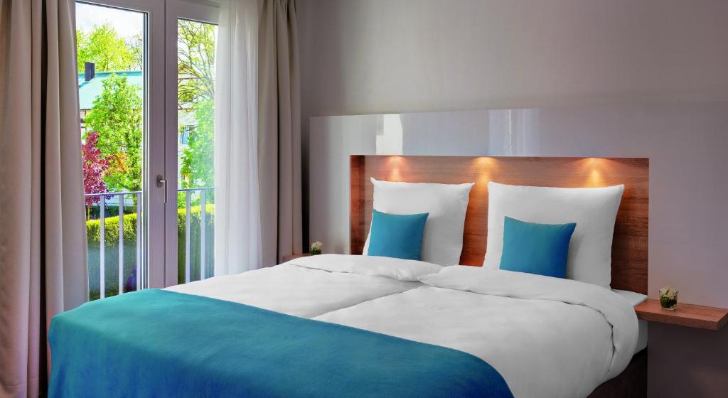 Postel nebo postele na pokoji v ubytování Hotel und Pension Seereich
