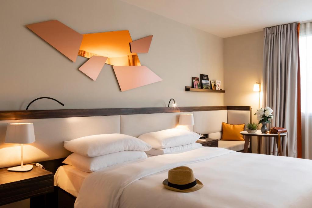 מיטה או מיטות בחדר ב-Radisson Blu Hotel, Paris Boulogne