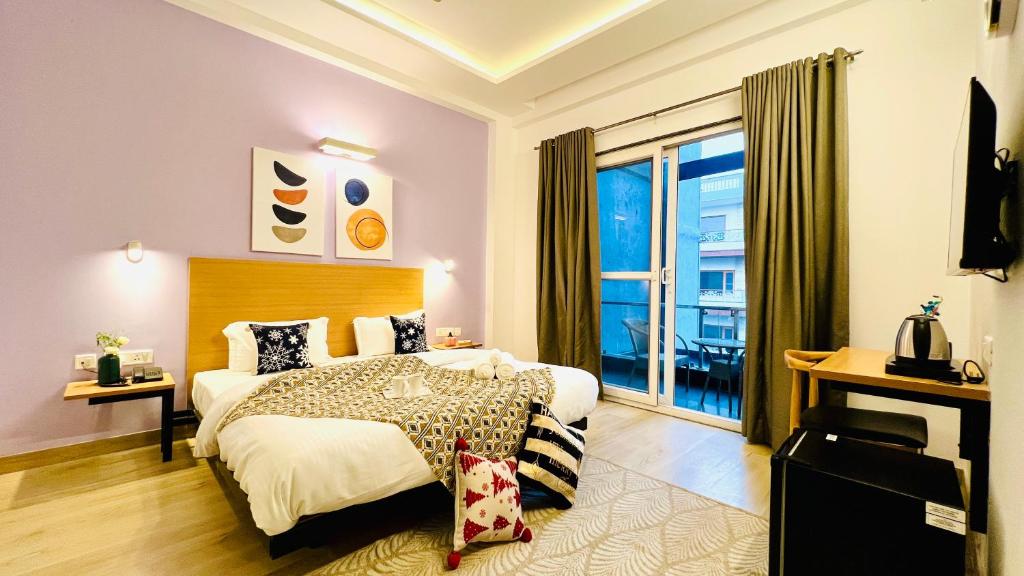 Ένα ή περισσότερα κρεβάτια σε δωμάτιο στο ZEN Medicity - Hotel & Serviced Apartments Gurgaon