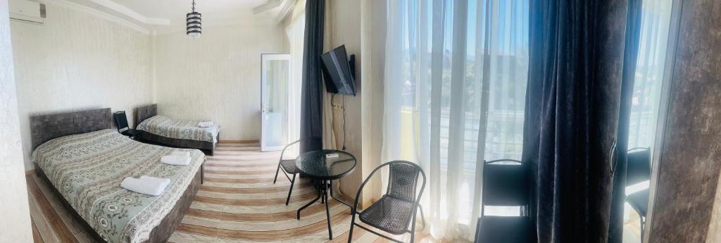 Postel nebo postele na pokoji v ubytování Hotel Buta