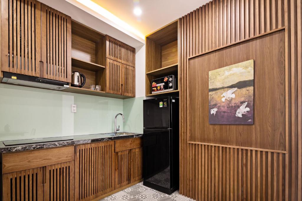 Kuchyň nebo kuchyňský kout v ubytování Hoàng Thịnh Hotel & Apartment Danang