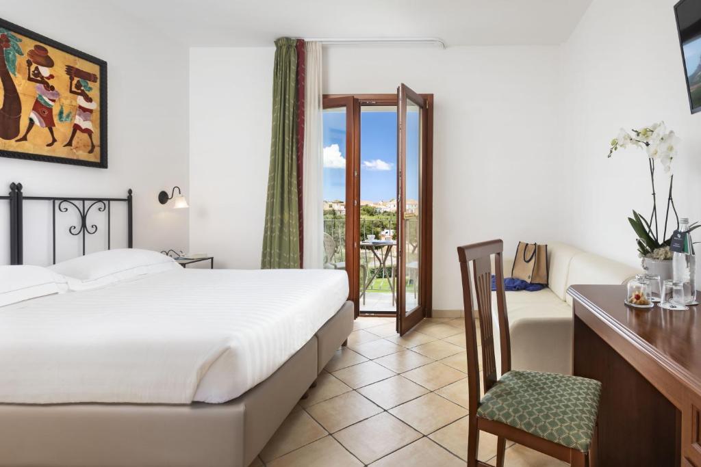 Postel nebo postele na pokoji v ubytování Blu Hotel Morisco