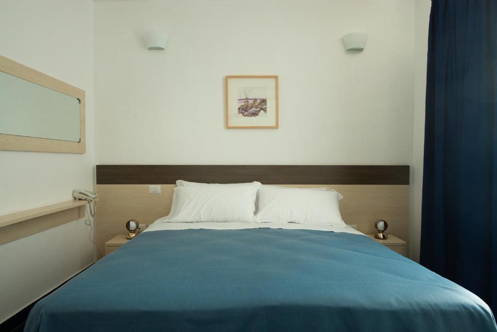 Postel nebo postele na pokoji v ubytování Tuareg Hotel