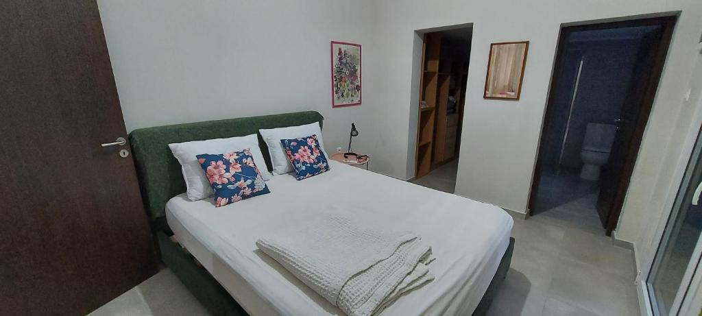 Ένα ή περισσότερα κρεβάτια σε δωμάτιο στο Joanna's place