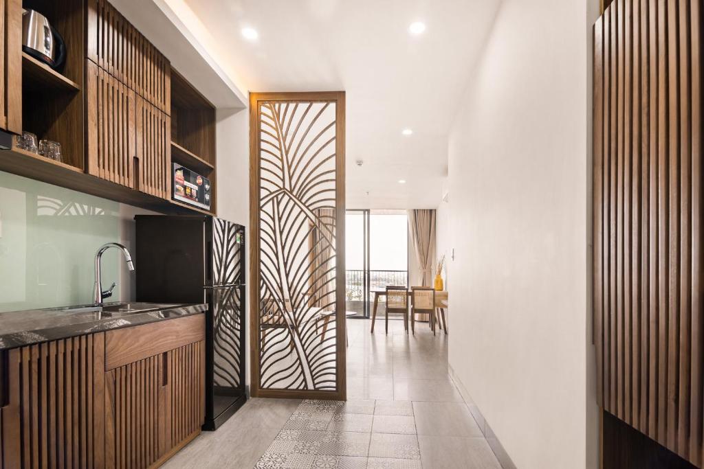 Kuchyň nebo kuchyňský kout v ubytování Hoàng Thịnh Hotel & Apartment Danang