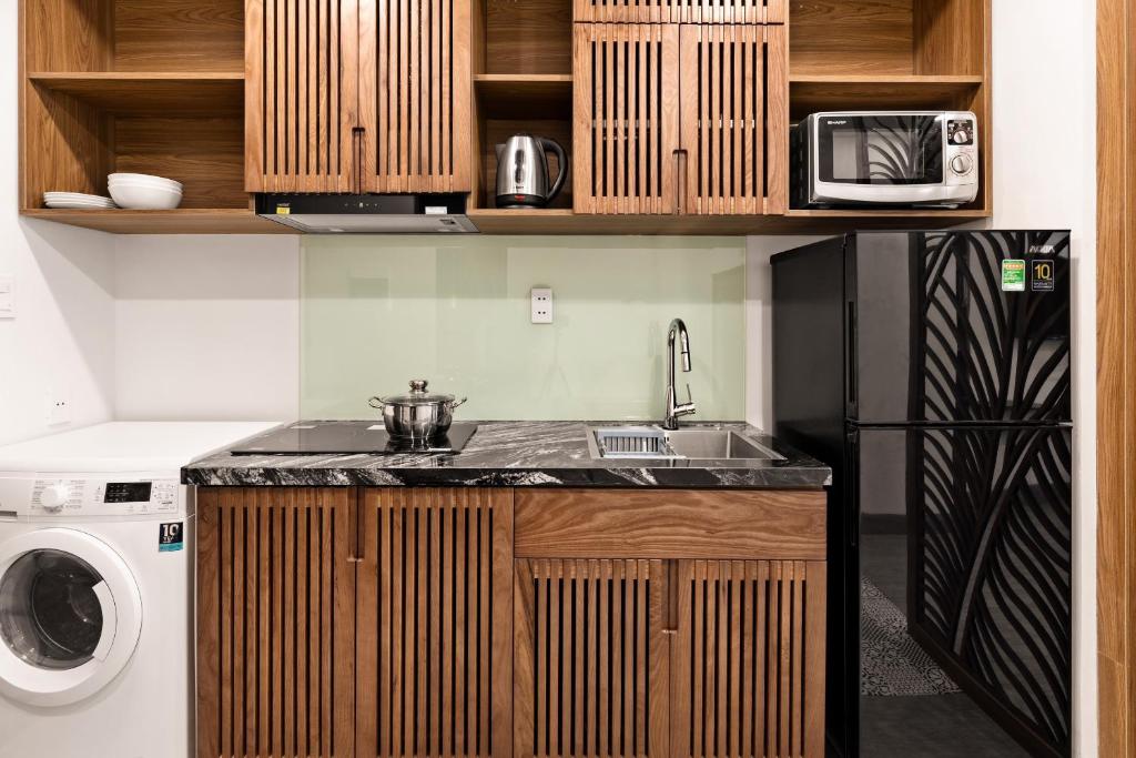 Kuchyň nebo kuchyňský kout v ubytování Hoàng Thịnh Hotel & Apartment Danang