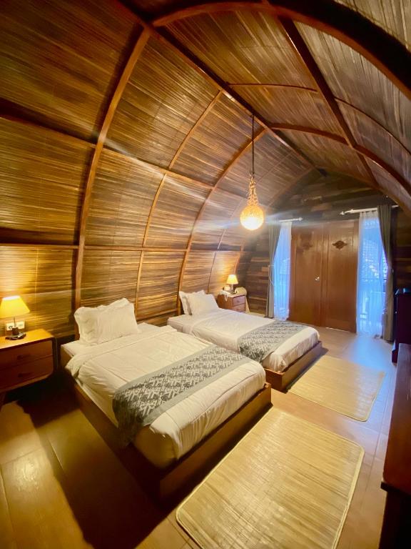Postel nebo postele na pokoji v ubytování Khanaya Hotel Borobudur