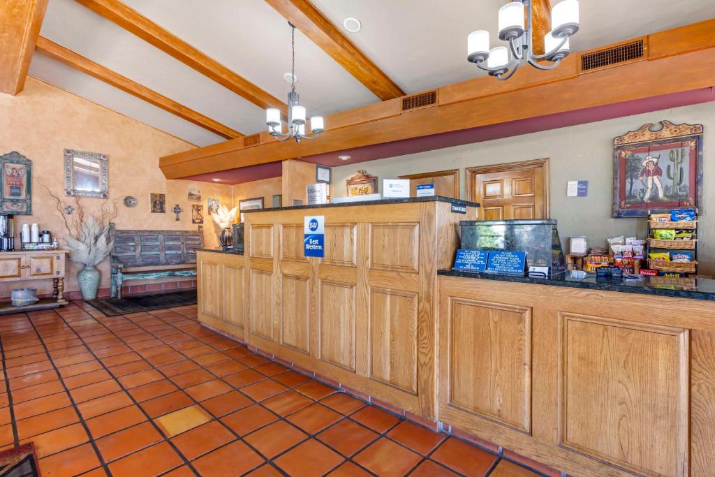 a large room with wooden cabinets in a store at Best Western Mission Inn in Las Cruces