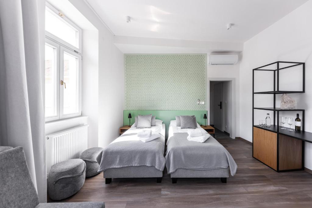Postel nebo postele na pokoji v ubytování Hotel Radost