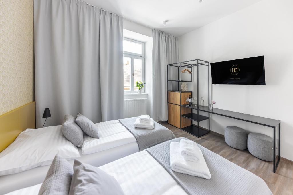 Postel nebo postele na pokoji v ubytování Hotel Radost