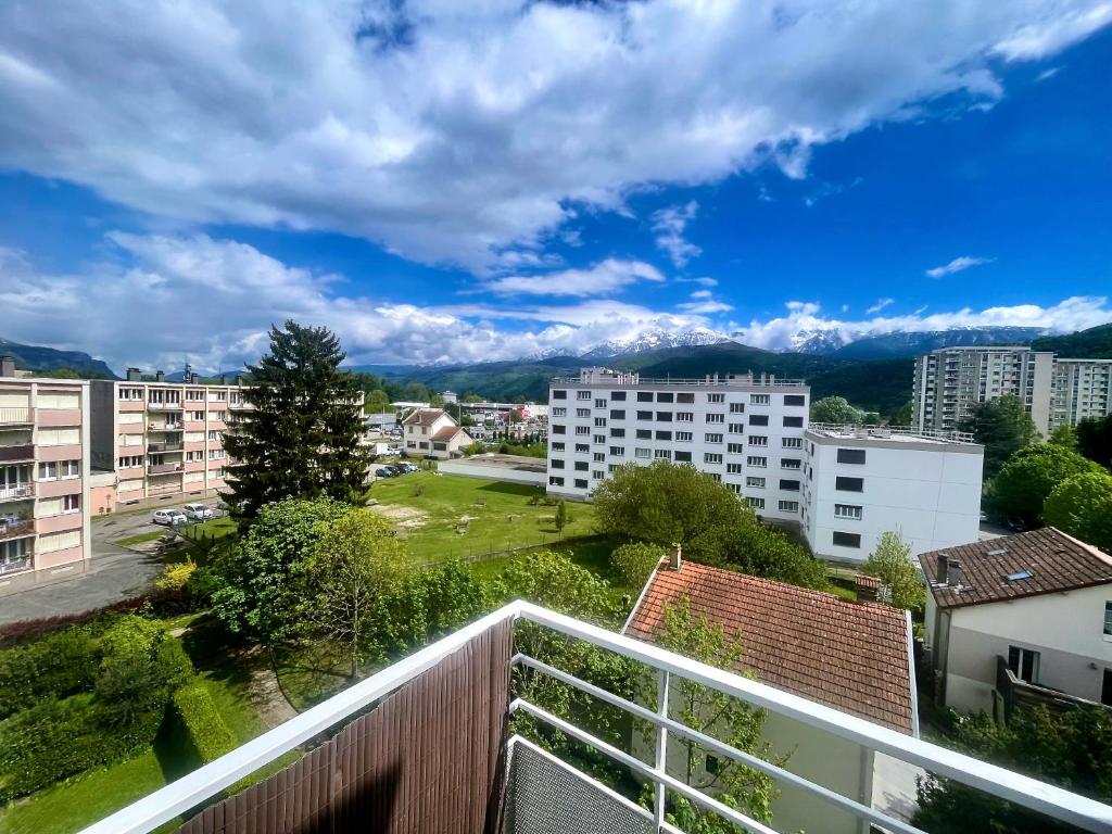 a view from the balcony of a apartment building at Neyrpic - Cocon douillet -balcon in Rhut