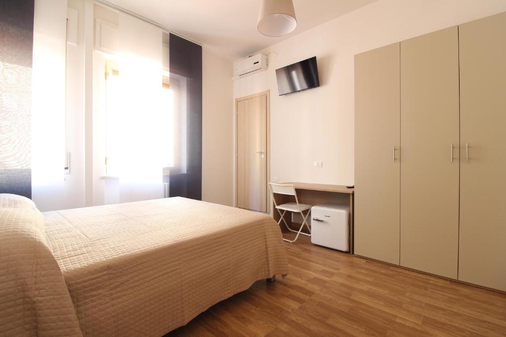 Postel nebo postele na pokoji v ubytování Acquacorrente Rooms - a due passi dal mare
