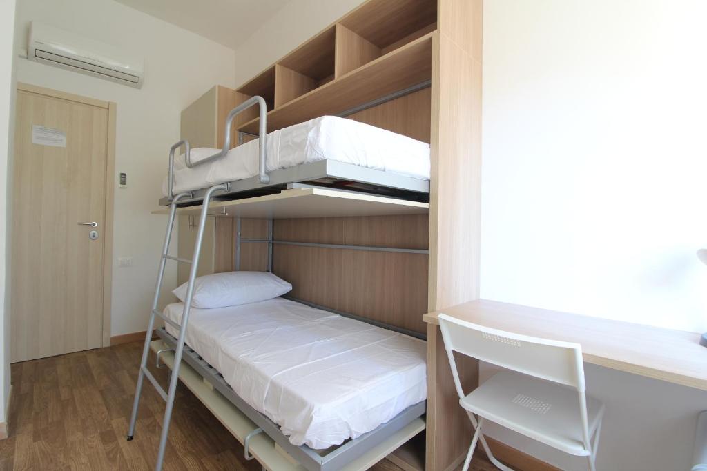 Postel nebo postele na pokoji v ubytování Acquacorrente Rooms - a due passi dal mare