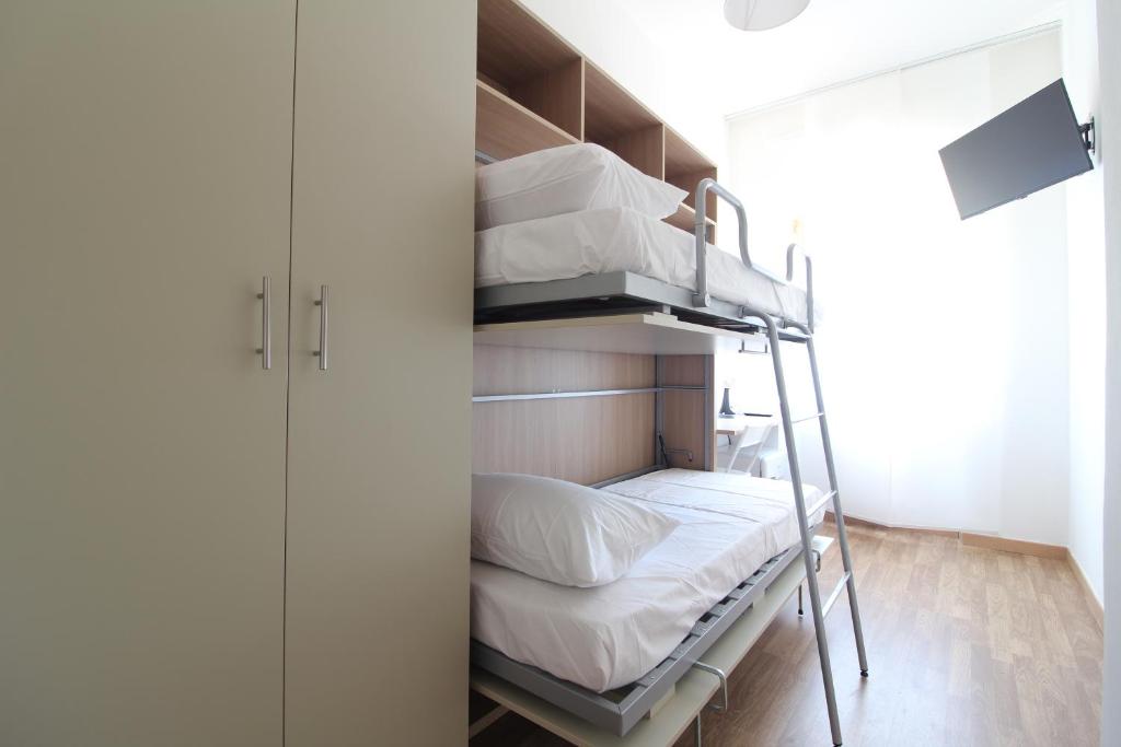 Postel nebo postele na pokoji v ubytování Acquacorrente Rooms - a due passi dal mare