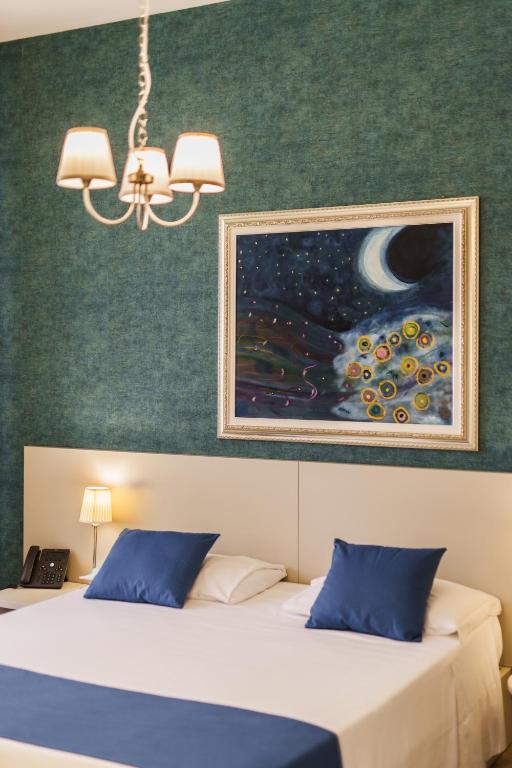 A bed or beds in a room at It's Room Naples