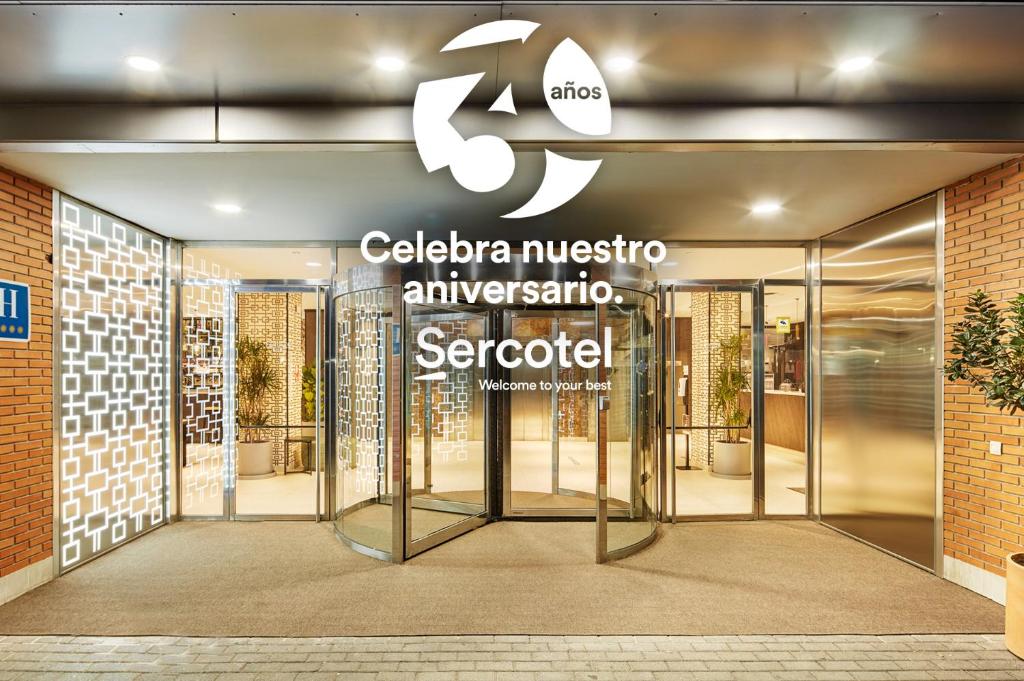 an entrance to a museum with a glass door at Sercotel Madrid Aeropuerto in Madrid