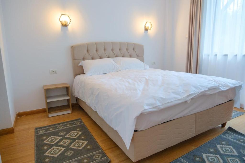 Postel nebo postele na pokoji v ubytování Hotel Parc Geoagiu Bai
