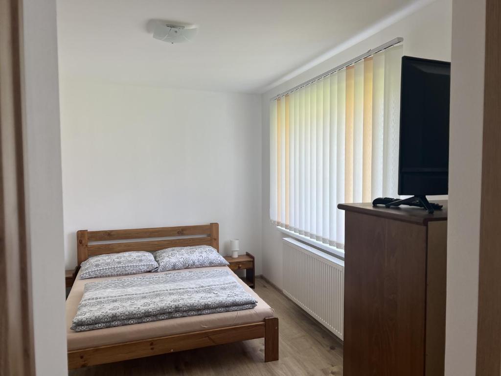 Postel nebo postele na pokoji v ubytování Apartmány Crystalindo