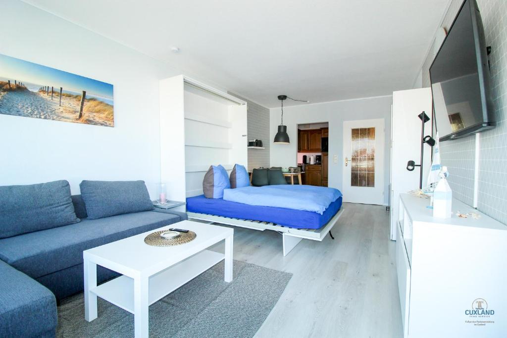 Televisyen dan/atau pusat hiburan di Haus Frische Brise Wohnung 7 10 Inselblick