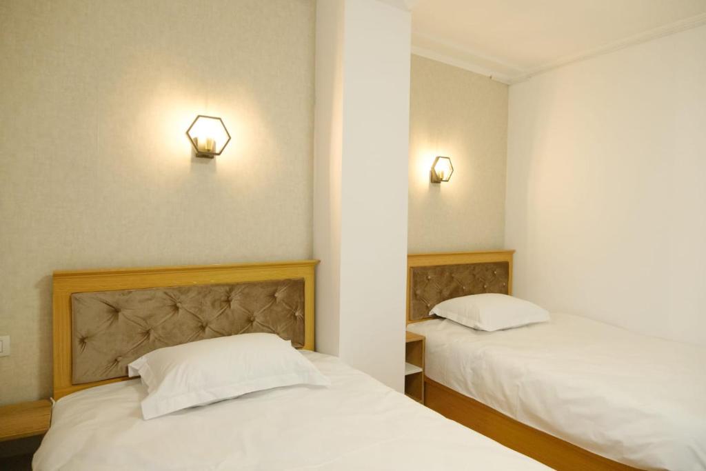 Postel nebo postele na pokoji v ubytování Hotel Parc Geoagiu Bai