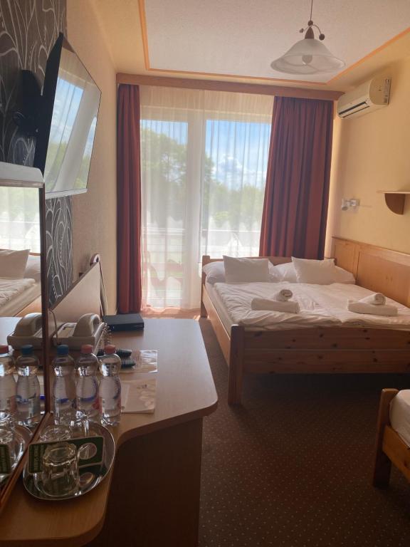 Postel nebo postele na pokoji v ubytování Nereus Park Hotel