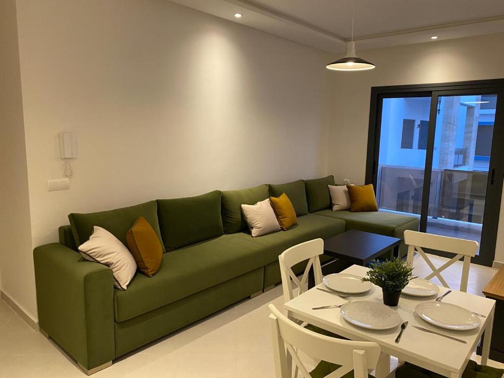 Posezení v ubytování Appartement avec vue piscine à centre ville martil