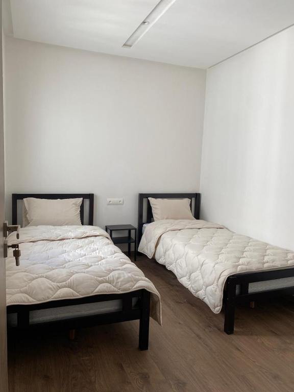 Postel nebo postele na pokoji v ubytování Appartement avec vue piscine à centre ville martil