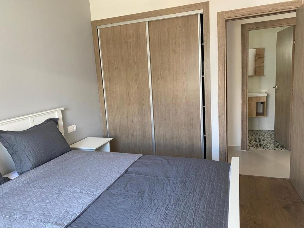 Postel nebo postele na pokoji v ubytování Appartement avec vue piscine à centre ville martil