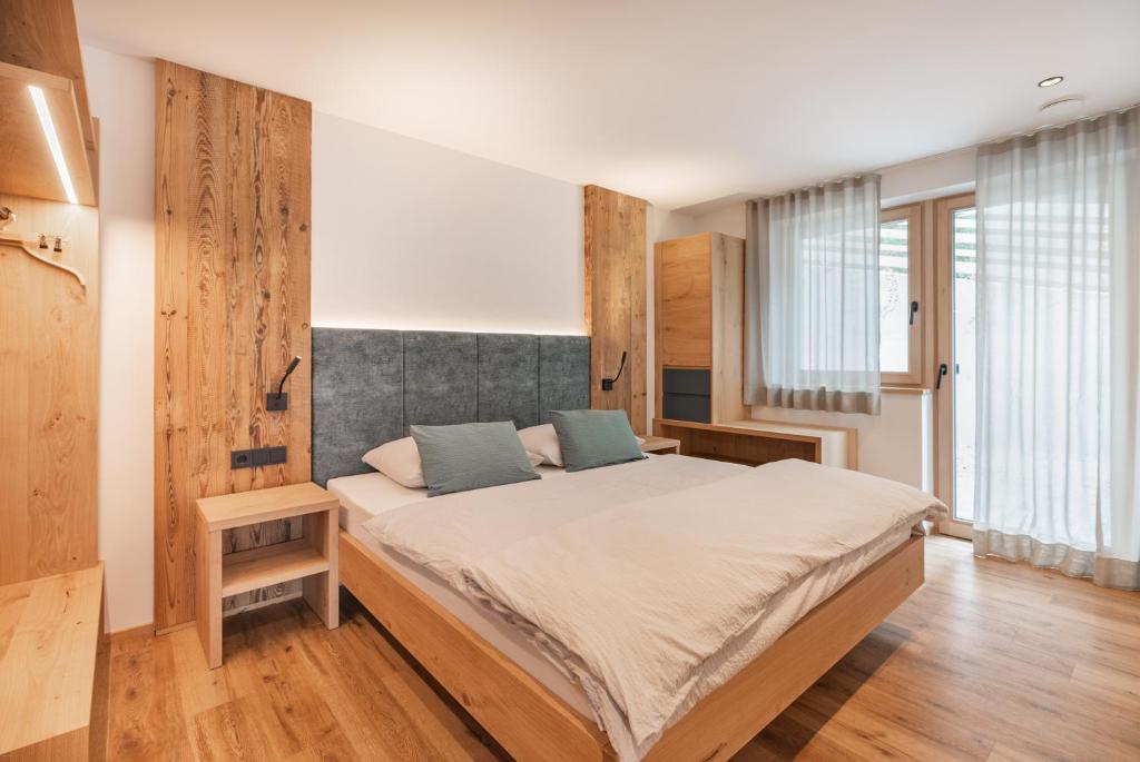 Postel nebo postele na pokoji v ubytování Linhea Apartments