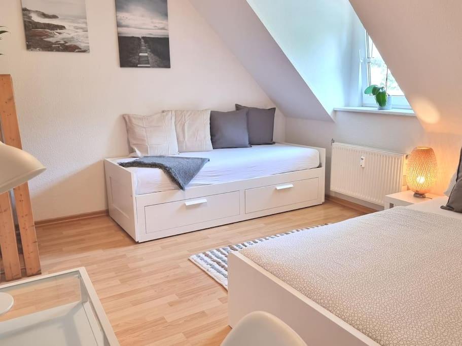 a living room with a white couch and a window at 2 room apt at It-district Neustadt & free parking in Dresden