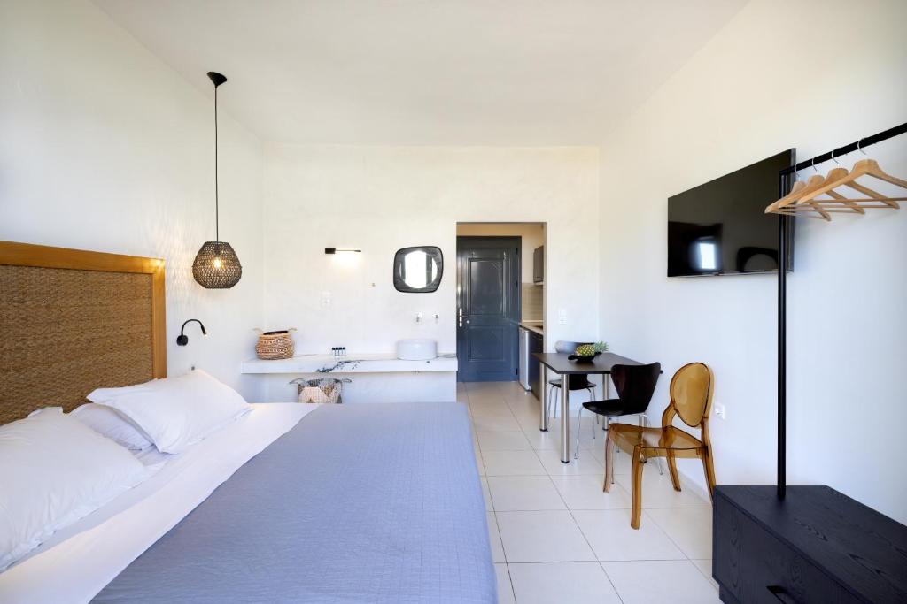 Postel nebo postele na pokoji v ubytování La Stella Suites