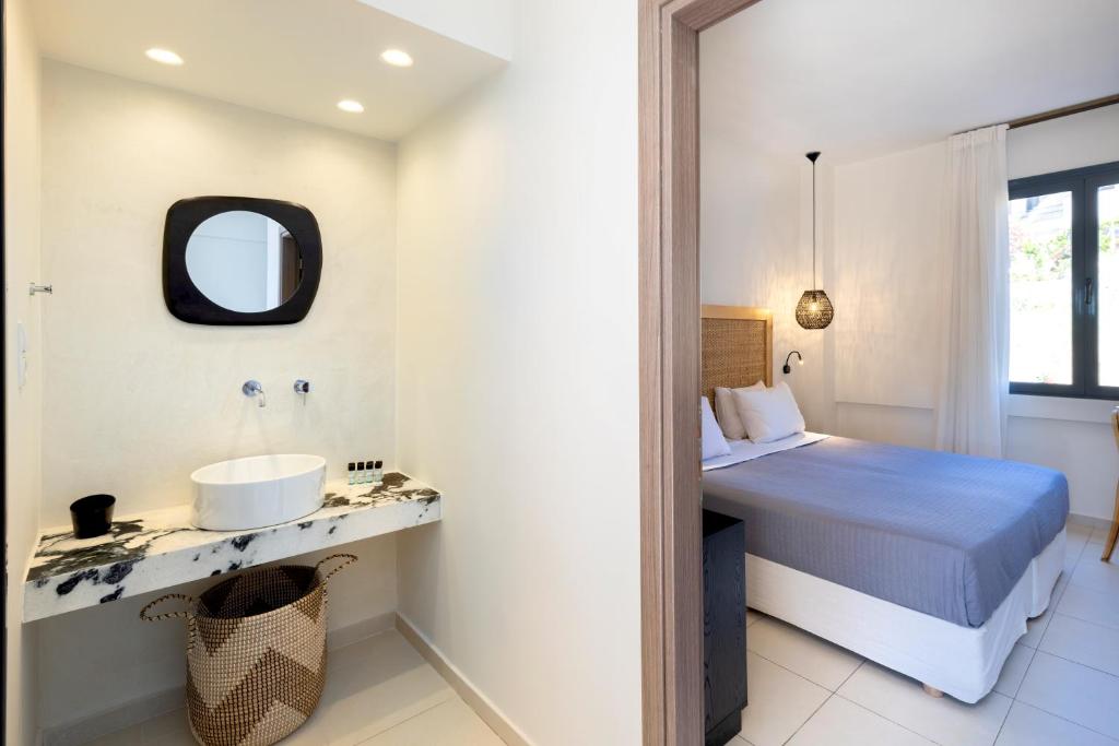 Postel nebo postele na pokoji v ubytování La Stella Suites
