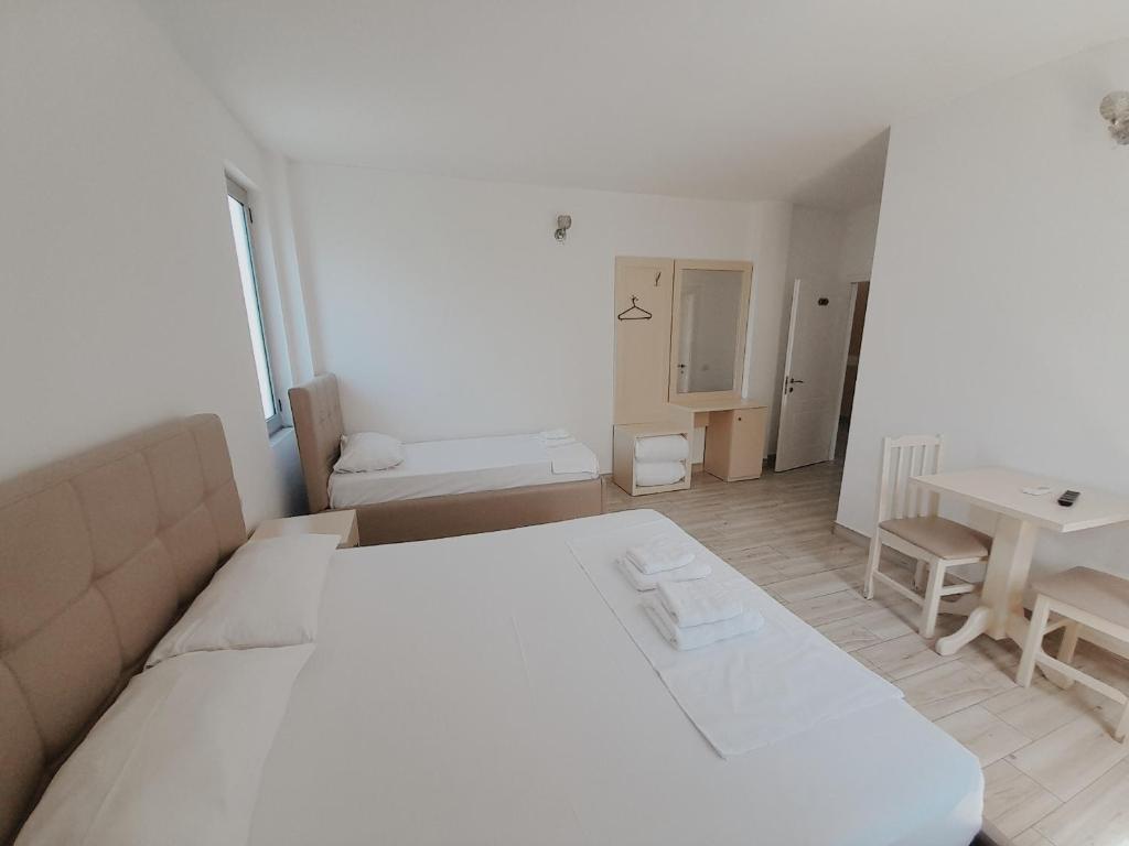 Postel nebo postele na pokoji v ubytování Hotel Restaurant Univers