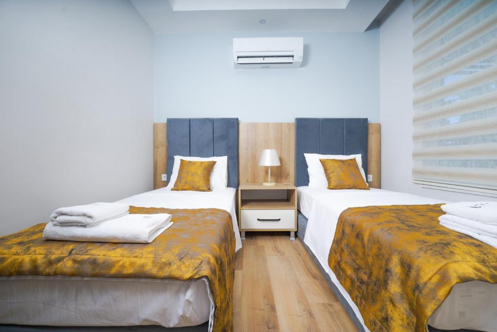 Postel nebo postele na pokoji v ubytování Han Apart Hotel Side