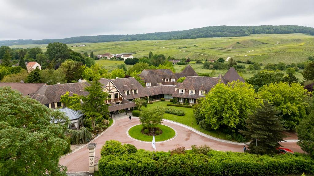 an aerial view of a large house with a driveway at Briqueterie Champagne, A Beauvallon Hotel & Spa in Vinay